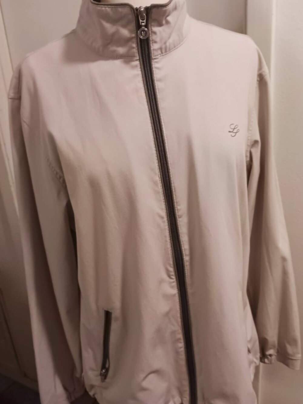 Women's light weight pearl gray zip up Linksoul golf jacket.